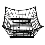 A black powder coated metal wire Transformer Basket with a square base and outwardly curved sides, creating a bowl-like shape. The grid design features wide, open squares, and the basket is photographed against a white background.