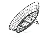A black food pan basket with a grid design, tilted at an angle on a stand. This adjustable metal basket is oval-shaped and appears empty, with shadows visible underneath on a white background.