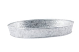 A shallow, oval-shaped metal tray with a hammered texture and silver finish, this galvanized dinner platter features slightly raised edges and a smooth rim for a rustic, industrial look. The background is plain white.