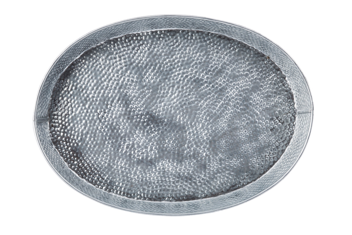 A round, shallow silver tray with a hammered texture and a smooth, slightly raised rim. The surface reflects light, highlighting the dimpled pattern. Styled like the TableCraft GP129 galvanized dinner platter, it's photographed from above on white.