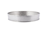 A round, silver stainless steel basket from the Brickhouse Collection, featuring short sides and a textured grid-like pattern. The smooth-rimmed serving platter sits on a plain white background.