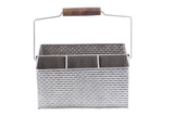 A rectangular, stainless steel flatware caddy from the Brickhouse Collection with a woven texture, three compartments, and a metal handle with a brown wooden grip, photographed against a white background.