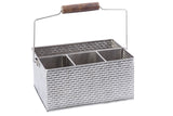 From the Brickhouse Collection, this stainless steel flatware caddy features a textured woven pattern, four interior compartments, and a wire handle with a wooden grip. The caddy is empty and set against a white background.