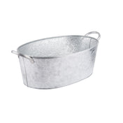 A shiny, oval-shaped galvanized steel beverage tub with a hammered texture and two handles on opposite sides. The silver TableCraft tub is set against a plain white background.