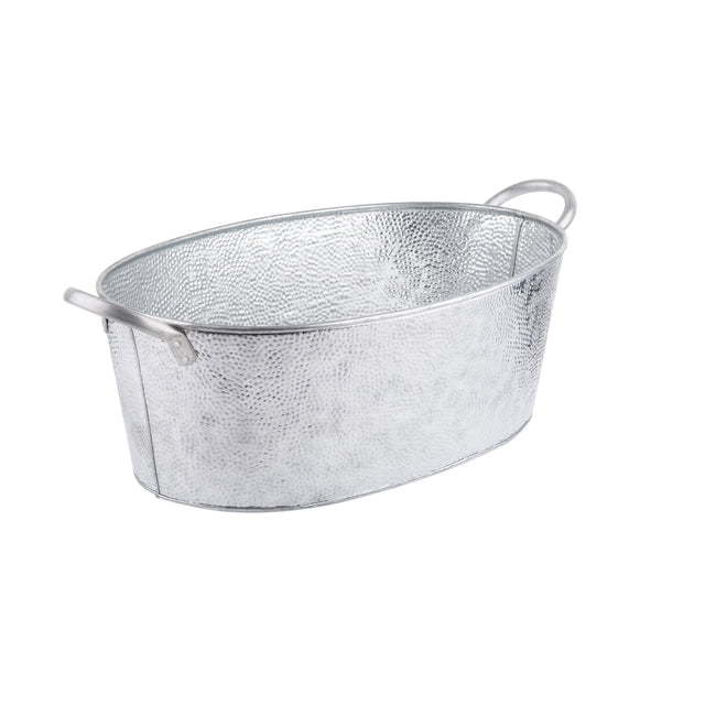 A shiny, oval-shaped galvanized steel beverage tub with a hammered texture and two handles on opposite sides. The silver TableCraft tub is set against a plain white background.