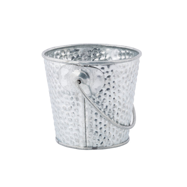 A small, round, silver galvanized pail with a hammered texture and a thin wire handle attached at the sides. The bucket is empty and displayed against a white background.