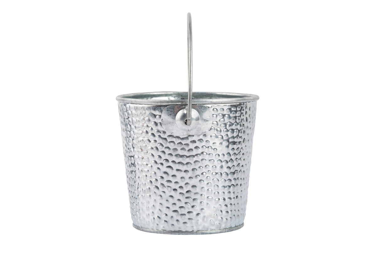 A small, metallic TableCraft Products galvanized pail with a hammered texture and thin metal handle stands upright against a plain white background, its shiny silver surface reflecting light and emphasizing the dimples.