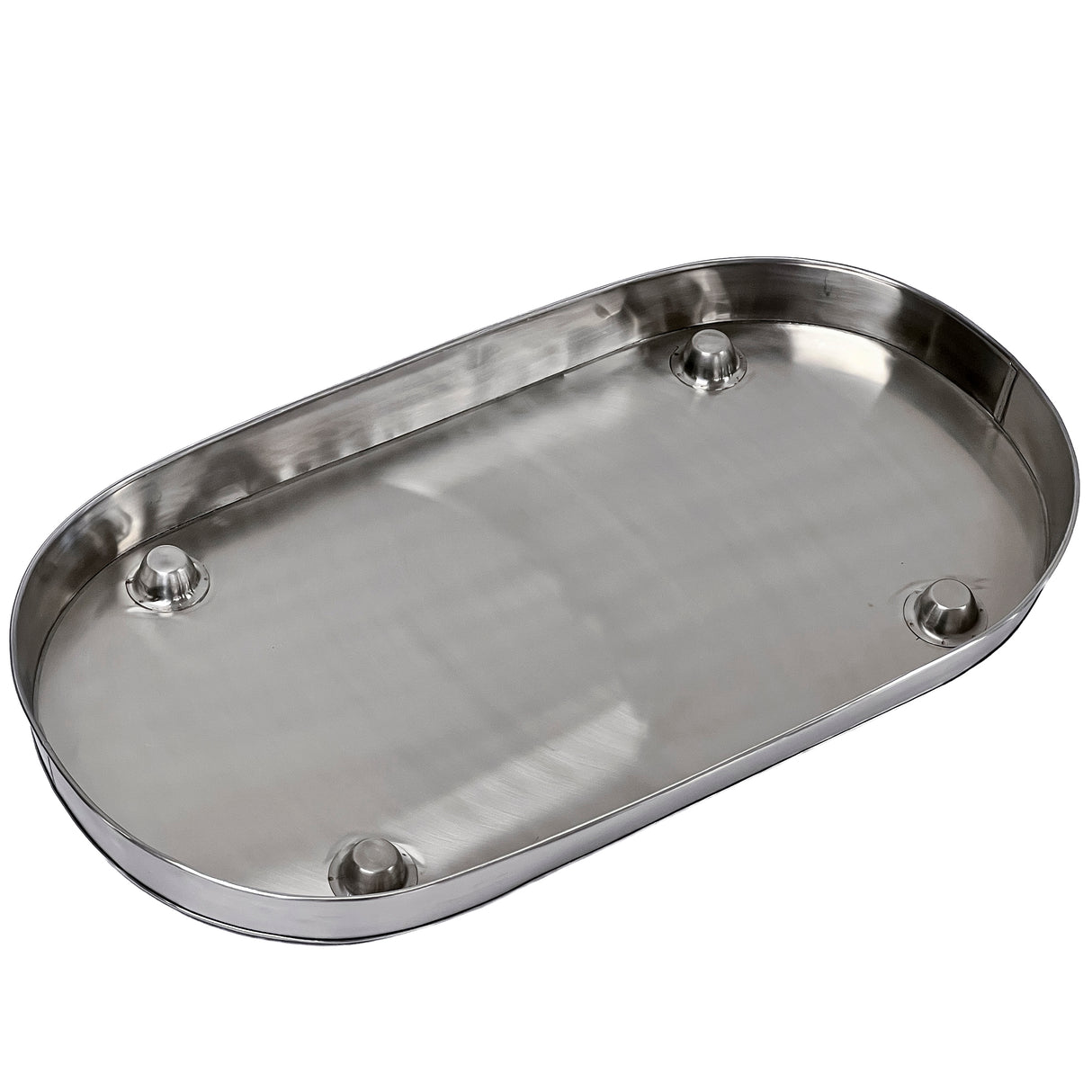 A shiny, oval-shaped stainless steel tray from the Brickhouse Collection features a smooth flat surface and raised rounded edges. Four small circular feet elevate this replacement condensation tray, which is empty and reflects light beautifully.