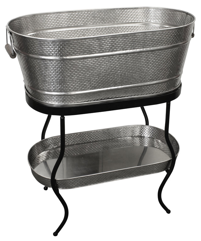 From the Brickhouse Collection by TableCraft Products, this Beverage Tub Set features a large, oval hammered metal tub with handles on a sturdy black stand. Below, a matching textured tray sits on the lower shelf for added style and function.