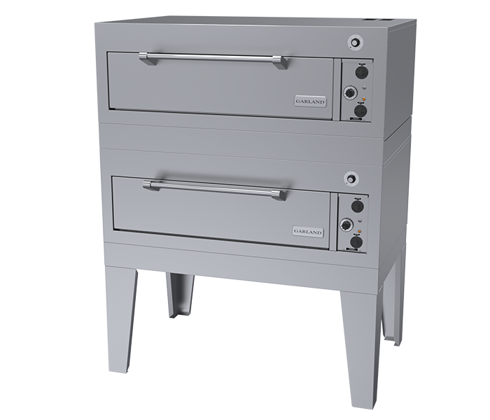 A double-deck commercial bake oven with a stainless steel finish. Each deck has a horizontal handle, rectangular door, and control knobs on the right. The electric deck oven stands on four sturdy legs, with the “Garland” brand visible on both doors.