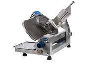 A commercial-grade Chefmate Series stainless steel 12 inch slicer with a circular blade, adjustable thickness knob, safety guard, and food tray. This compact slicer with blue branding sits on four black feet against a white background.