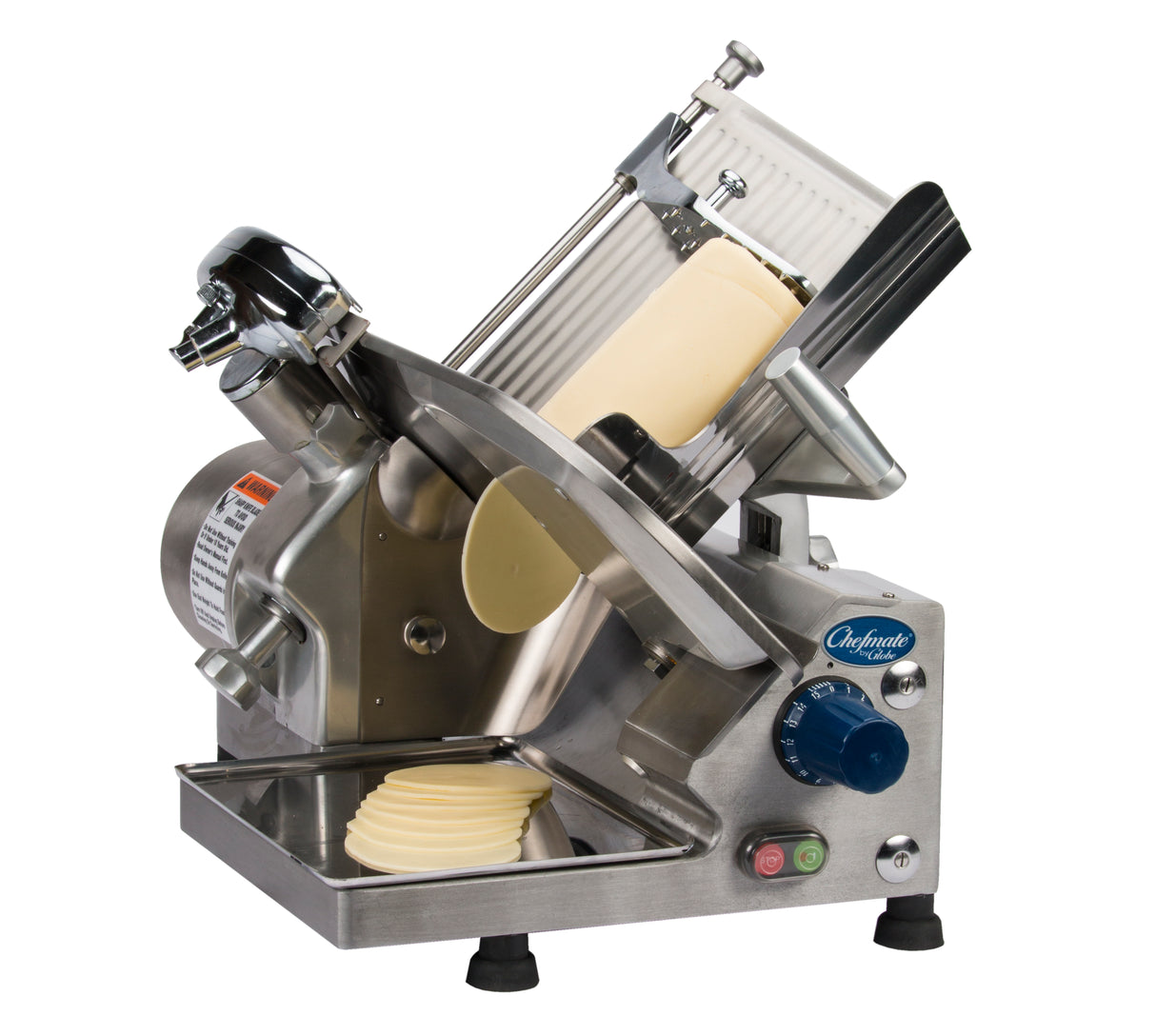 A commercial 12 inch slicer from the Chefmate Series features a rotary blade cutting a block of cheese. Thin slices stack neatly on a tray below. The compact slicer is metallic with dials, buttons, and a safety guard, labeled “Chefmate.”.