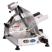 A Chefmate food slicer, crafted from stainless steel, features a circular blade, 12" knife, adjustable thickness knob, on/off buttons, safety warning labels, and non-slip feet. This electric slicer is set against a pristine white background.
