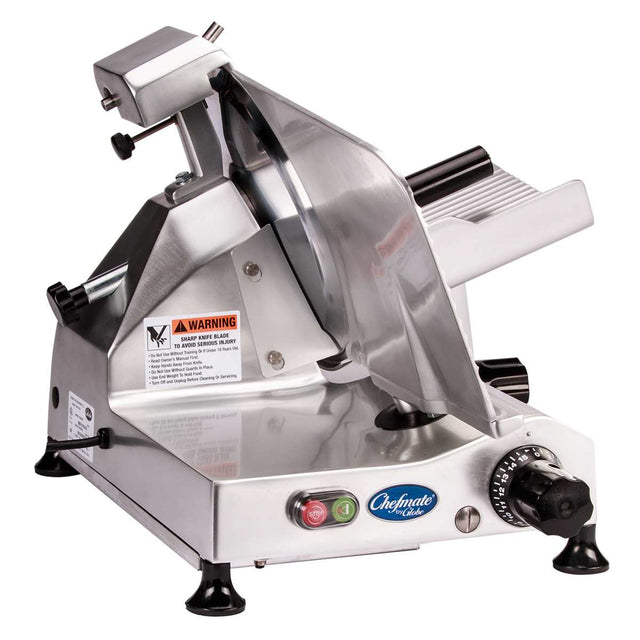 A Chefmate food slicer, crafted from stainless steel, features a circular blade, 12" knife, adjustable thickness knob, on/off buttons, safety warning labels, and non-slip feet. This electric slicer is set against a pristine white background.