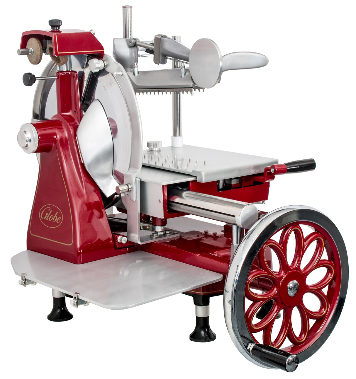 A vintage-style Italian-designed flywheel slicer in red and silver features a large spoked wheel, hand crank, blade guard, adjustable thickness settings, and sturdy legs with suction cups. The word Globe is visible on the side.