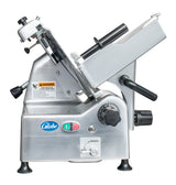 A stainless steel automatic food slicer with a 12 inch knife, slanted tray, black handles, adjustment dial, and power switches. The Globe brand, manual/auto mode switch, and warning label are visible. The slicer is set against a white background.