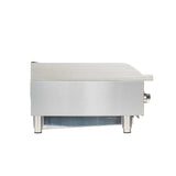 A side view of a stainless steel countertop radiant charbroiler with heavy duty cast-iron grates, featuring a flat cooking surface, four short cylindrical legs, and a round control knob on the right. The background is plain white.