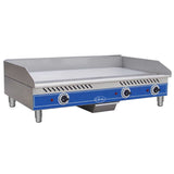 This electric countertop griddle features a stainless steel flat top, three control knobs, a blue front panel, side and back splashes, short legs, indicator lights, and a central grease tray for easy cleanup.