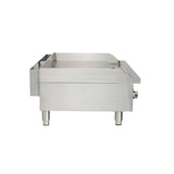 A stainless steel gas countertop griddle is shown from the side. It features a flat cooking surface, raised back and side edges, two sturdy cylindrical legs, thermostatic controls, and a control knob on the right. The background is plain white.