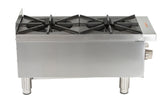 A stainless steel commercial gas countertop stove with two large cast iron burners and sturdy black grates, viewed from the front and slightly above. The stove features heavy-duty metal legs and control knobs on the front right side.