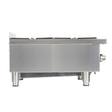 A stainless steel Globe GHP24G gas countertop hotplate viewed from the side, showing four sturdy legs, a metal exterior, and a control knob on the right. Cast iron burners and burner grates are visible on top, with no pots or additional objects present.