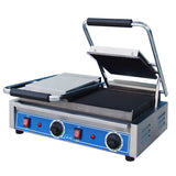 A commercial electric countertop grill with a stainless steel body, two ribbed cast iron plates on top, two flat plates below, black handles, and a blue control panel featuring two temperature dials and four red on/off switches.