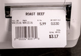 A printed label from a label printing scale shows ROAST BEEF, weight 0.530 lb, price $5.99/lb, total $3.17. Sell by Nov. 23, 2016; pack date Nov. 22, 2016. Barcode and numbers below, with the label partially in a machine.