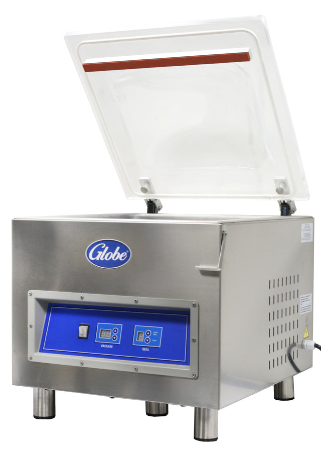A stainless steel vacuum packaging machine with a clear, open lid. The blue front panel features control buttons, digital displays, and is labeled Globe. It stands on short legs with side vent openings and supports marination programming for versatile use.
