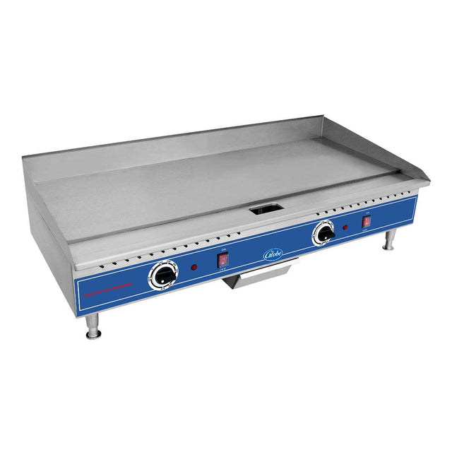 A rectangular stainless steel Globe PG36E electric countertop griddle with a flat cooking surface, two temperature control knobs, indicator lights, a blue front panel, drain slot in the middle, and four adjustable legs—ideal for any professional kitchen.
