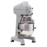 A large, industrial-grade planetary mixer with a metallic finish, featuring a digital control panel, protective wire guard, and a stainless steel mixing bowl. This sturdy 20 qt mixer sits on solid legs and has knobs for adjusting settings.