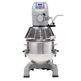 A 20 qt planetary mixer with a large stainless steel mixing bowl, digital control panel, enclosed protective wire guard, and sturdy gray base. A lever and attachment arm are visible on the right side of this commercial bench mixer.