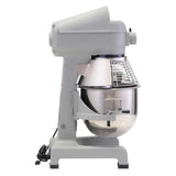 A professional-grade, gray planetary mixer with a large stainless steel mixing bowl and protective wire guard is shown in profile. This robust bench mixer features a sturdy metal base, control knob, and coiled power cord resting on the ground.