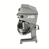 A commercial floor mixer with a metal bowl and safety guard, featuring a control panel with warning labels and a large round adjustment wheel on the side. This 42 qt mixer is solid gray, sturdy, and set against a white background.