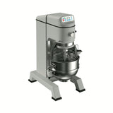 A large, industrial commercial dough mixer with a metallic body, digital control panel on top, and a stainless steel mixing bowl with a wire safety guard. This 60 qt mixer stands on four sturdy legs and is shown on a plain white background.