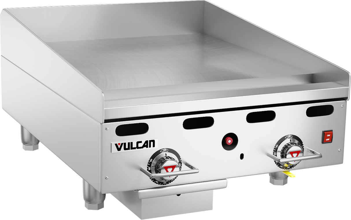 A heavy duty countertop gas griddle, this 24" stainless steel model features two control knobs, a flat cooking surface, raised back and side guards, short legs, plus the Vulcan logo on the front panel with a red power indicator light and rectangular switch.