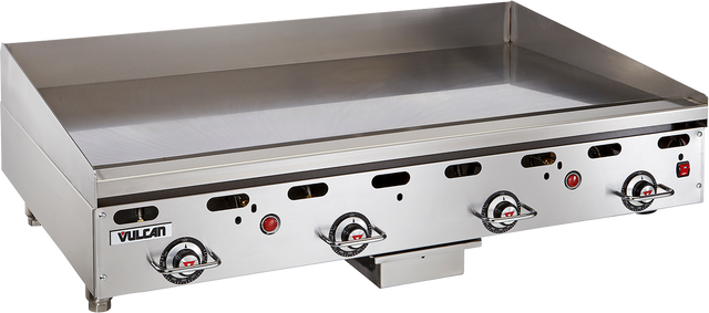 A large commercial Vulcan 948RX heavy duty griddle with four control knobs, an ignition button, and raised back and side splashes. The clean, shiny countertop gas griddle surface is ideal for cooking large quantities of food. Vulcan logo is visible on the front panel.