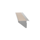 A metal stair nosing with a beige non-slip insert, angled to show the profile. The nosing features a durable stainless steel finish, a flat top surface with the insert, and an extended lip for secure stair tread coverage. The background is plain white.