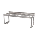 A stainless steel Vulcan wall-mounted overshelf with a slatted surface and a raised back edge. The angular, sturdy support brackets attach beneath each side. This industrial, durable design is ideal for kitchens or workspaces and features a removable wire rack.