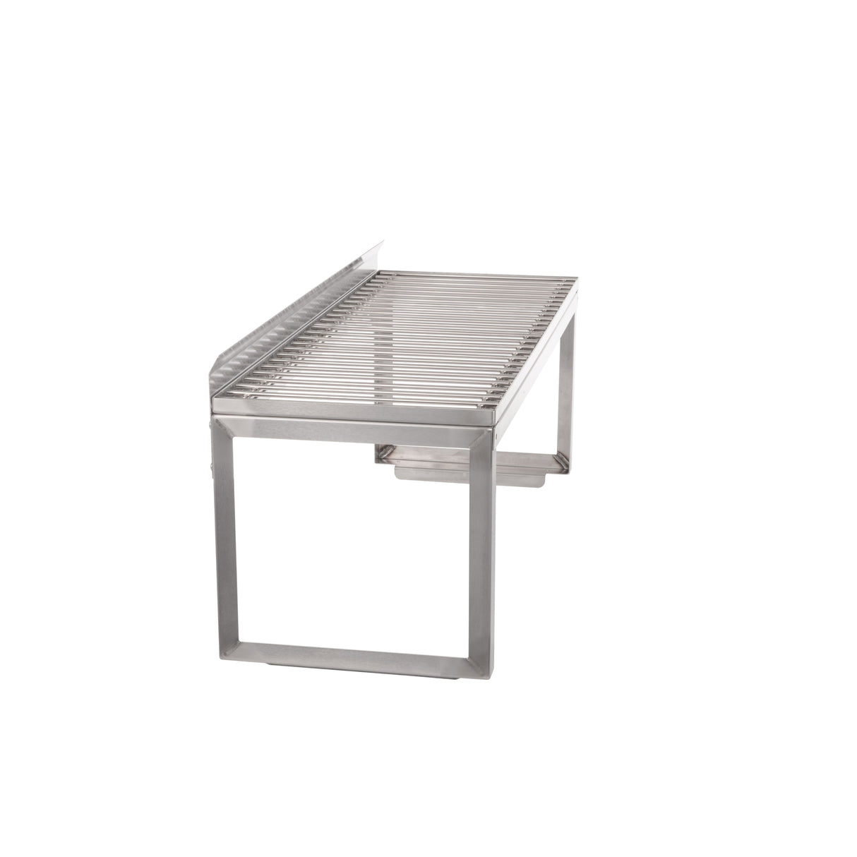 A stainless steel tabletop grill with a rectangular frame and parallel grill bars, elevated on sturdy legs. Featuring a removable wire rack, the open design has clean, modern lines and a minimalist look, set against a plain white background.