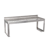 A Vulcan stainless steel wall-mounted overshelf with a slatted design features horizontal bars as the shelf surface, a raised back edge, and rectangular legs with mounting brackets; includes an optional removable wire rack for added versatility.