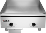 A heavy duty electric countertop griddle with raised sides, two front control knobs, indicator lights, and the Vulcan brand on the front left panel. The polished steel griddle surface is clean and empty.