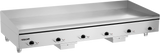 A large 72 inch Heavy Duty Griddle with a smooth stainless steel surface, five black control knobs, the "Vulcan" brand logo on the left, and short legs for countertop use. This electric countertop griddle is clean and unoccupied.