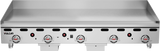 A large Heavy Duty Griddle with four control knobs and indicator lights on the front panel. The Vulcan logo appears on the lower left. This 60 inch countertop gas griddle features a flat, spacious surface with splash guards on three sides.