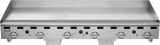 A heavy duty griddle, this stainless steel countertop gas griddle features five control knobs with red heat indicators. The 72 inch griddle surface is bordered by raised edges, and the Vulcan brand name appears on the lower left corner.