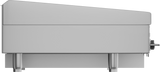 Side view of a modern stainless steel kitchen appliance, resembling a compact heavy duty griddle or countertop oven, featuring a slanted top, two cylindrical legs, a smooth metallic finish, and a control knob on the right side. Background is plain white.