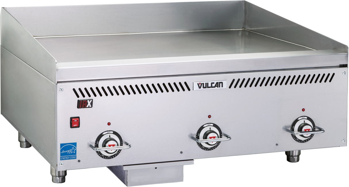 A heavy duty Vulcan countertop gas griddle featuring a smooth Rapid Recovery composite plate, three front control knobs, ventilation slots above the controls, and sturdy short metal legs. Ideal for high-performance commercial cooking.