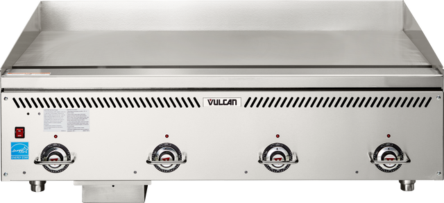 A commercial countertop gas griddle with three front control knobs, a VULCAN logo in the center, a smooth heavy duty griddle surface, and vented slits above the knobs. Features a blue certification sticker on the lower left front.
