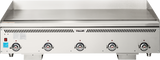 A large stainless steel Heavy Duty Griddle with four control knobs and indicator lights on the front panel. The spacious flat surface is ideal for cooking multiple foods, and Vulcan’s name is centered above the controls on this countertop gas griddle.