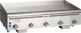 A large, commercial countertop gas griddle with four control knobs on the front panel, labeled “Vulcan.” This heavy duty griddle features a smooth, flat cooking surface, raised backsplash, vent slots above the controls, and stands on four short legs.