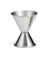 A stainless steel jigger with two conical measuring cups joined at the base, one larger and one smaller, designed for measuring spirits or cocktail ingredients. The smooth, reflective surface is dishwasher safe. The background is plain white.